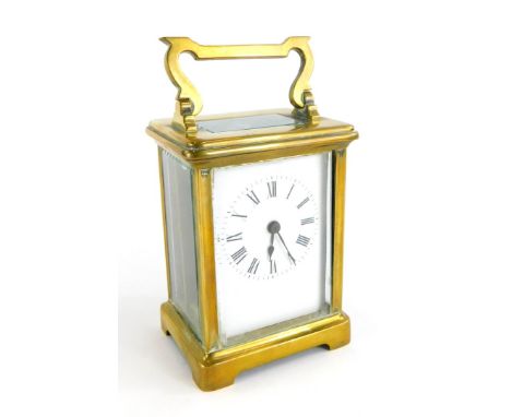 A French R and C brass carriage clock, the white enamel dial with Roman numerals, stamped made in Paris, 15cm high.