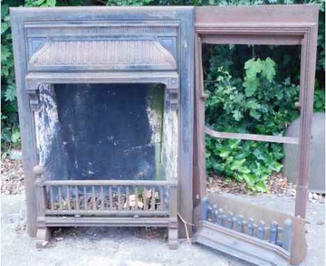 A late 19th/early 20thC cast iron fireplace, with grate, decorated with geometric devices, 71cm wide, and a part cast iron su