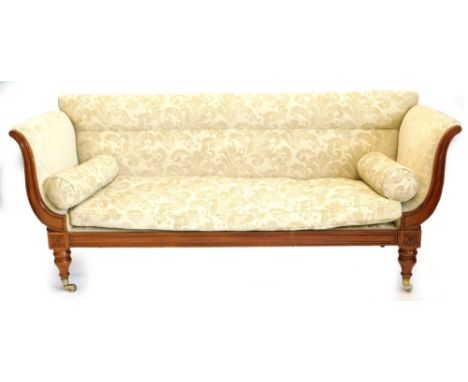 A William IV mahogany sofa, with leaf and scroll patterned upholstery, carved supports to the arms, on turned tapering legs h