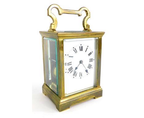 A French brass carriage clock, with white enamel dial, in heavy case with bevel glass, unmarked, 17cm high overall.