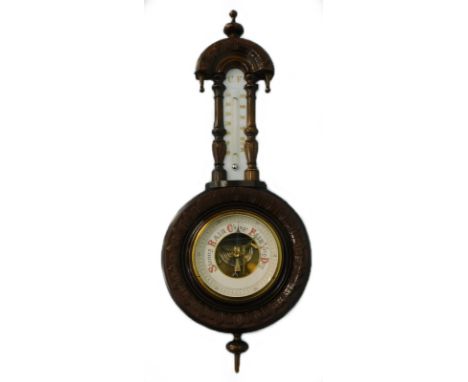 A Victorian walnut cased aneroid barometer, with carved case and ceramic thermometer, 55cm high.