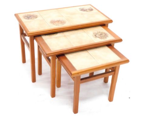 A nest of three teak tables, each with a painted tile design of badgers, white tailed Deer and otters, the largest 64cm wide.