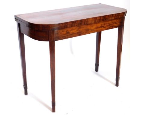 An early 19thC mahogany D shaped card table, with a boxwood strung and crossbanded border, on square tapering legs, 92cm wide