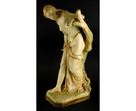 A Royal Worcester porcelain figure of Bather Surprised, modelled beside a tree stump on a canted rectangular base, signed by 