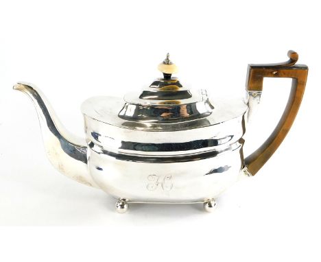 A late George III cushion shaped teapot and cover, with an ivory mushroom finial, angular fruitwood handle, engraved with let