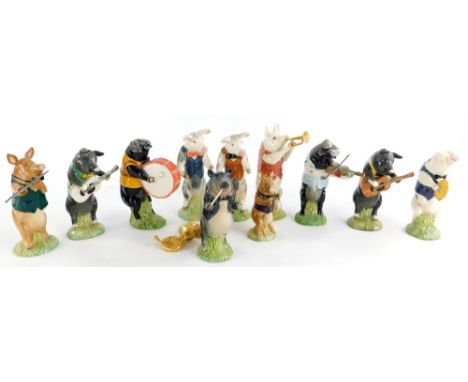 A collection of Beswick pig figures, each playing a musical instrument, to include Richard, Benjamin, Matthew, etc. (11)