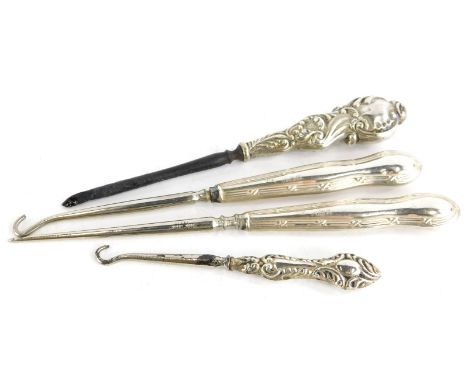 A collection of small silver, to include three silver handled button hooks, and a further silver handled item, possibly from 