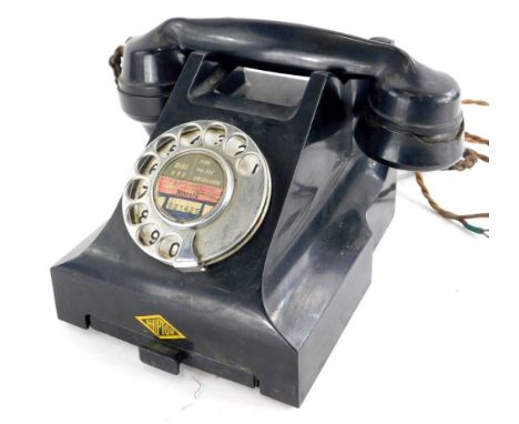 A vintage black Bakelite telephone, label to front for Shipton, number to underside 4509B.