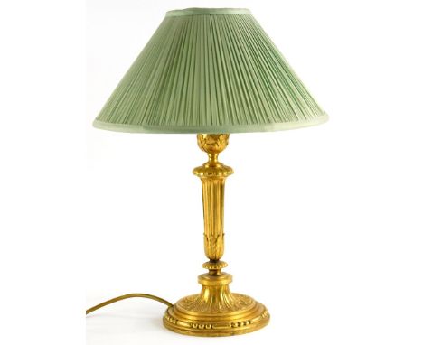 A late 19th/early 20thC French gilt metal lamp base, with fluted column cast with leaves, etc., 44cm high.