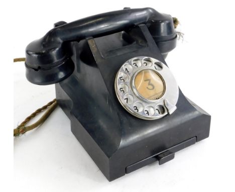 A vintage black Bakelite telephone, stamped to underside 4509B. (AF)