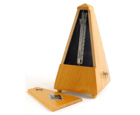 A German metronome, in an elm case, 22cm high.