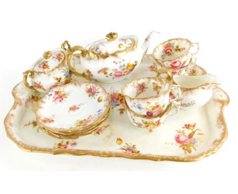 A Hamersley and Co cabaret tea set, comprising teapot and cover, two handled covered sugar bowl, milk jug, four cups and four