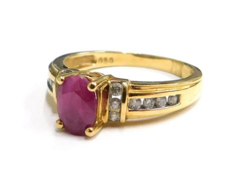 An 18ct gold ruby and diamond dress ring, the oval and cut ruby in four claw setting, with six diamond set shoulders, six dia