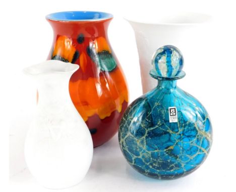 A Mdina glass bottle and stopper, with typical mottled decoration and paper label, 19cm high, a Poole pottery Delphis type va