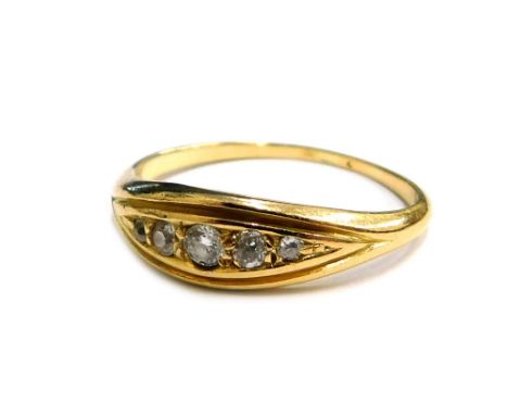 A diamond set dress ring, set with five tiny diamonds in diamond shaped ring head, in a yellow metal setting, unmarked, ring 