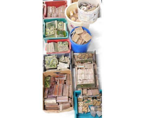 A large quantity of Victorian and later floor tiles, tiles for edges, green glazed ceramic tiles decorated with scrolls, leav