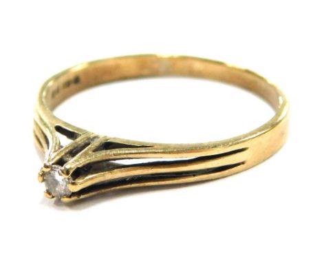 A 9ct gold diamond solitaire ring, the round brilliant cut stone held in by six claws, each from a thin band, ring size K½, 1