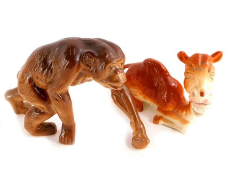 Two Melba ware figures, one modelled in the form of a chimpanzee, the other a caricature of a camel.  