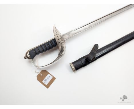 A GEORGE V 1897 PATTERN INFANTRY OFFICER'S SWORD BY WILKINSON, IN ITS BLACK LEATHER FIELD SERVICE SCABBARD.
We offer in-house
