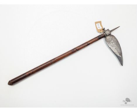 A 19TH CENTURY NORTH INDIAN CROW'S BEAK "ZAGNAL" AXE, WITH ITS SILVER DECORATED HEAD, ARMOUR PIERCING TIP.&nbsp;Mounted on a 