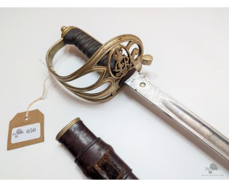 A SCARCE INDIAN POLICE OFFICER'S SWORD BY J.R. GAUNT AND SON (THURKLE). GOTHIC HILT AND LEATHER SCABBARD. MOST LIKELY GEORGE 