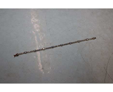 A Sterling silver gilt and cubic zirconia tennis style bracelet 