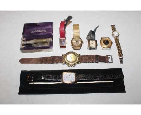 A box containing vintage and other watches and a razor 