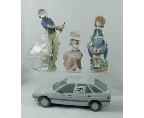 A collection of figures to include Lladro Ford Escort 1990 (wing mirrors reattached), Nao The School Girl (boxed) and Nao Out