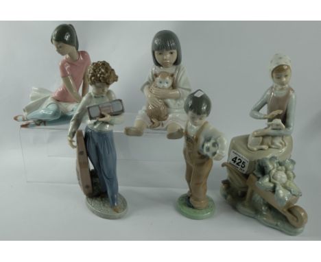 A collection of figures to include Lladro Shelley (has repair and small chip), Nao Wanna Play, Lladro 5810 Musically Inclined