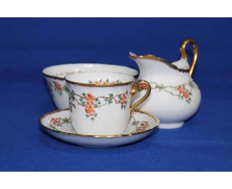 HAND-PAINTED TUSCAN FINE BONE CHINA PART TEA SERVICE
decorated with red flowers and green leaves on a white ground, with gilt