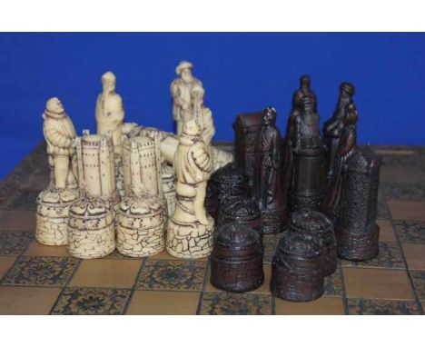 CHESS SET AND BOARD
made of moulded resin in the form of medieval Kings and Queens of Scotland and England, on a large moulde