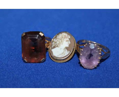 TWO GOLD DRESS RINGS
including a citrine set example and a light amethyst example; together with a cameo set gold bar brooch 