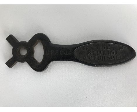 A Redline Motor Spirit branded petrol can cap spanner.