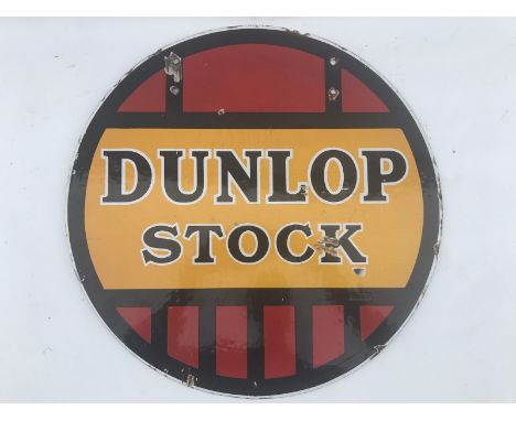 A Dunlop Stock circular double sided enamel sign with good gloss, 18" diameter.