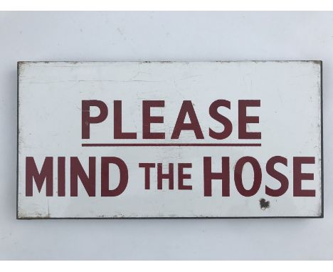 A small rectangular enamel sign - 'Please mind the hose', 17 1/2 x 9".