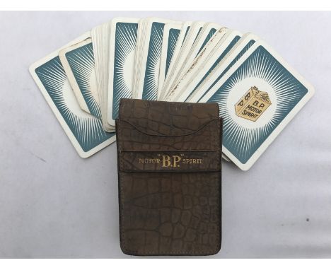 A BP Motor Spirit leather cased group of playing cards with Irish starburst design.