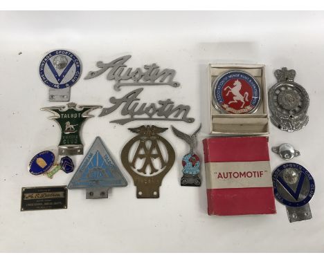A quantity of car badges to include an early brass AA badge, a Talbot Owner's Club enamel badge, a Citroen lapel badge etc. 