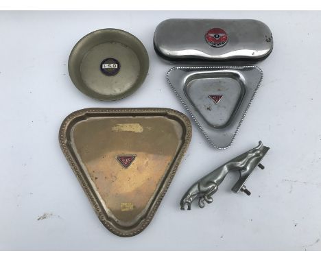 Two triangular ashtrays bearing an Alvis enamel motif to the centre, a small leaping Jaguar mascot, a circular pin dish with 