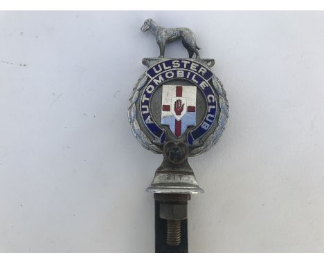 An Ulster Automobile Club part enamel car badge stamped no. 217.