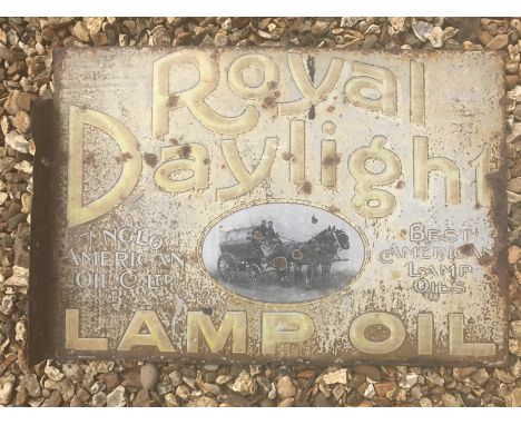 An early Royal Daylight Lamp Oil double sided enamel sign with hanging flange and central black and white image of a horse-dr