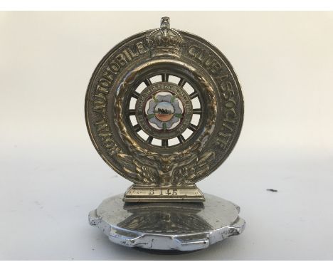A Royal Automobile Club associate car badge with North Yorkshire Automobile Club enamel centre stamped B145, the enamel centr