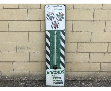 A Duckham's Adcoids black and white thermometer with glass tube, 11 x 45 1/4".