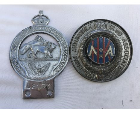 A Royal East African Automobile Association badge no. L2133 and a Royal Automobile Club Associate badge with Hong Kong centre