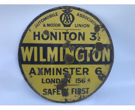 An early AA and Motor Union circular enamel village/road sign for Wilmington, Honiton 3 1/2, Axminster 6, by Bruton, 30" diam