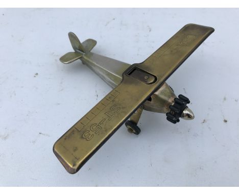 A table lighter in the form of a model of the Spirit of St. Louis aeroplane. 