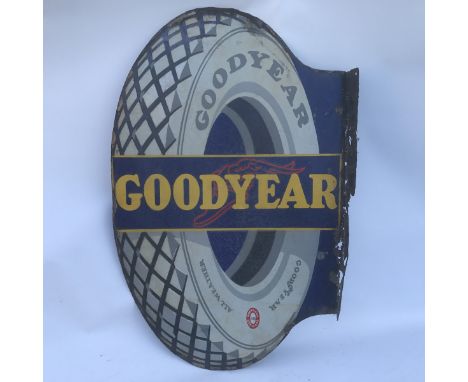 A Goodyear Tyre shaped double sided enamel sign with hanging flange, 22 x 34".