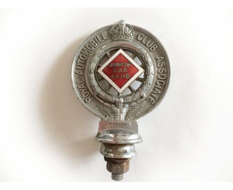 A Royal Automobile Club Associate car badge with Junior Car Club enamel centre.