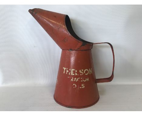 A Thelson Tractor Oils quart oil measure.