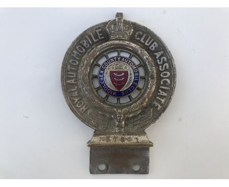 A Royal Automobile Club Associate car badge with Middlesex County Automobile Club part enamel centre, by D.G. Collins of Lond