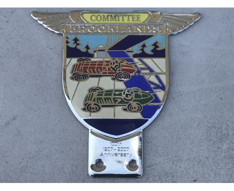 A 100th Anniversary Official reproduction Brooklands Committee enamel badge by Toye Kenning and Spencer.